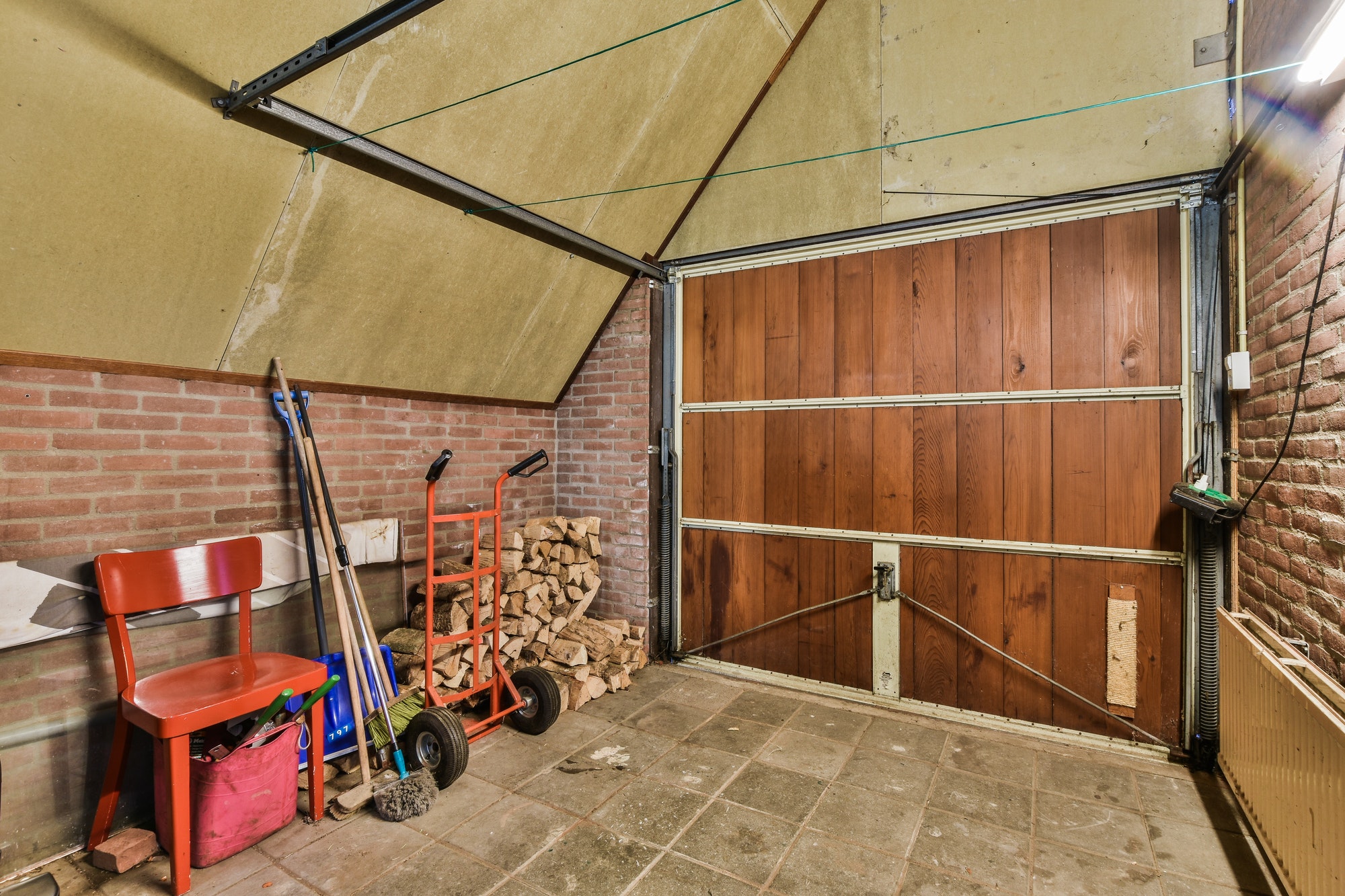 Spacious garage with brick walls